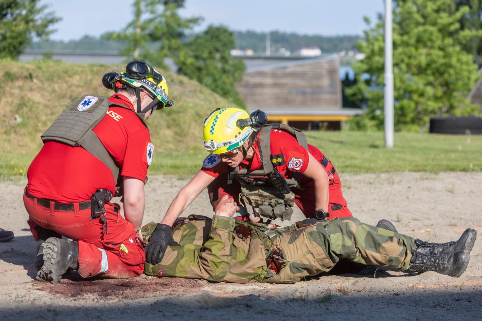 Event staff and role players preparing a scenario at NMC26